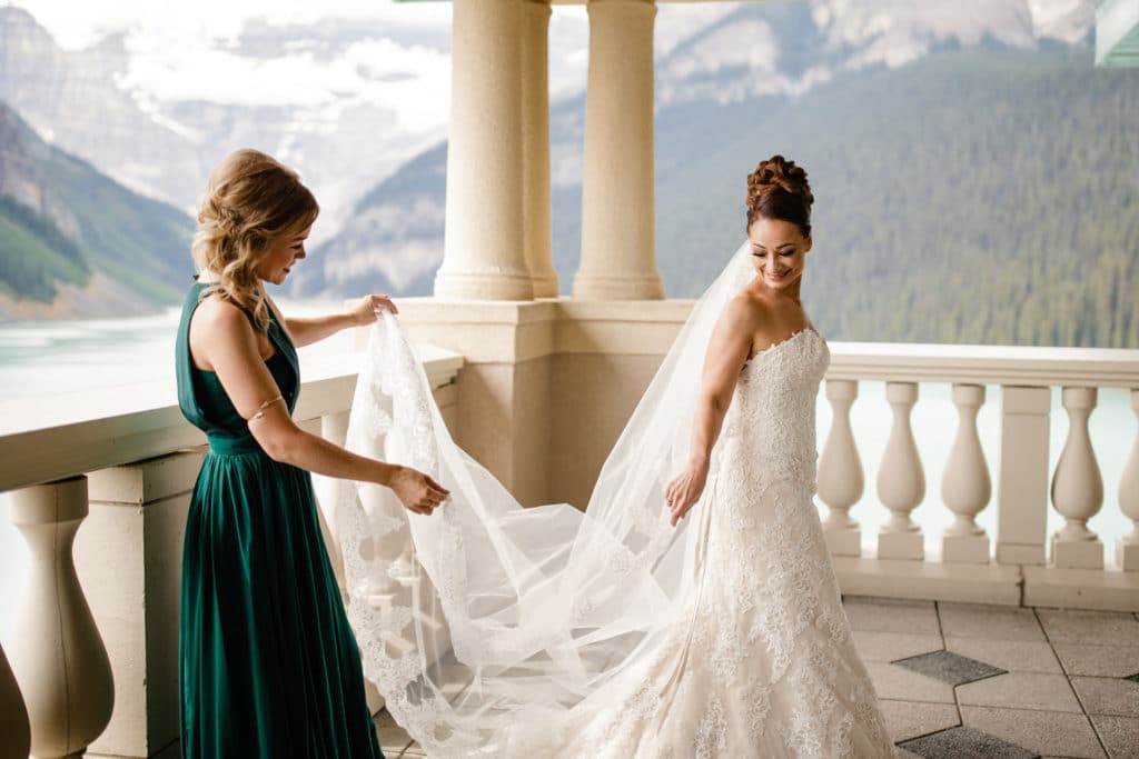 Bride getting ready in the Belvedere Suite with Lake Louise in the background
