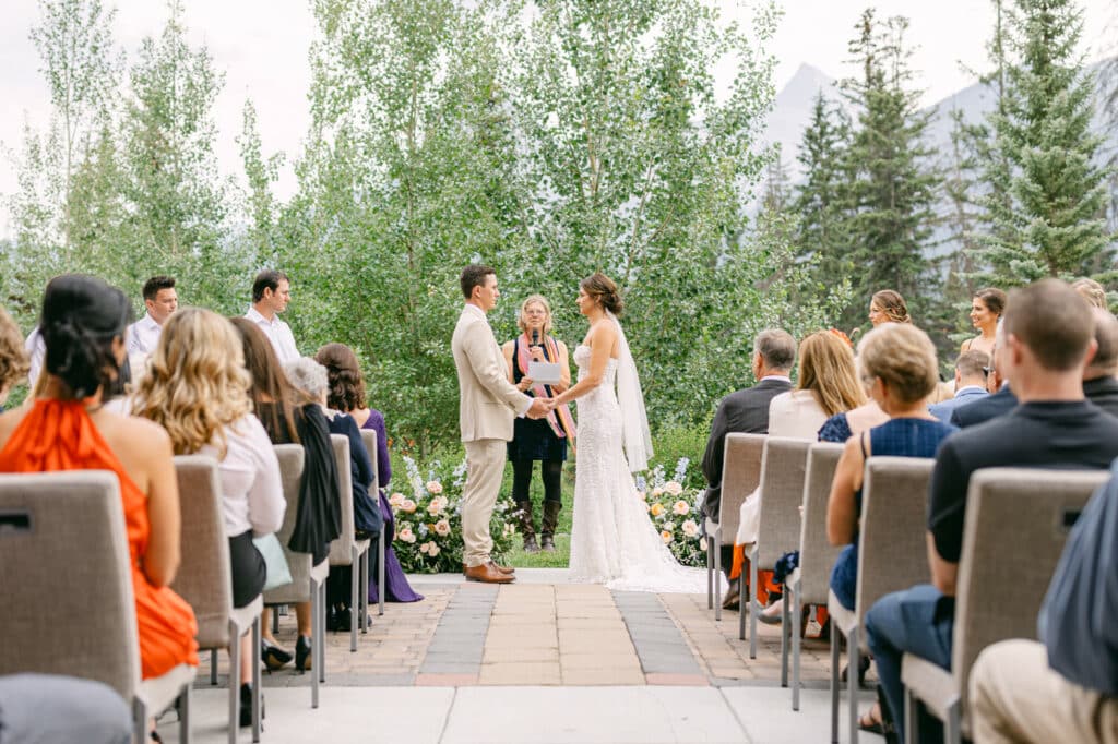 Wedding ceremony with bride and groom at the Malcolm Hotel in Canmore