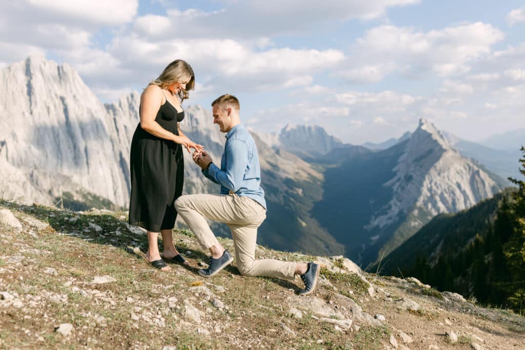 Jordan proposing to Mackenzie on top of a ridge in the Banff National Park