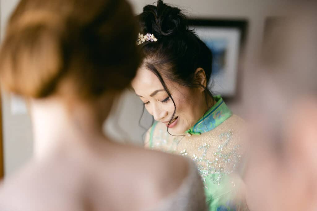 Mother helping bride get ready in Canmore