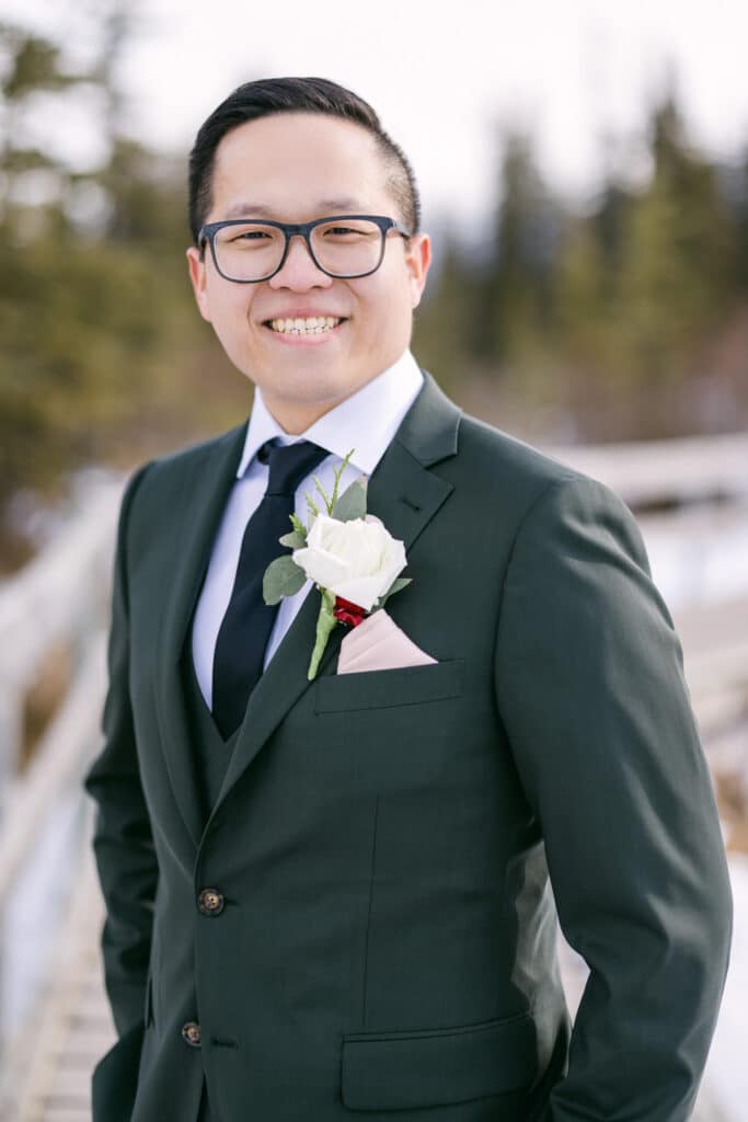 Groom smiling in Canmore after just getting married