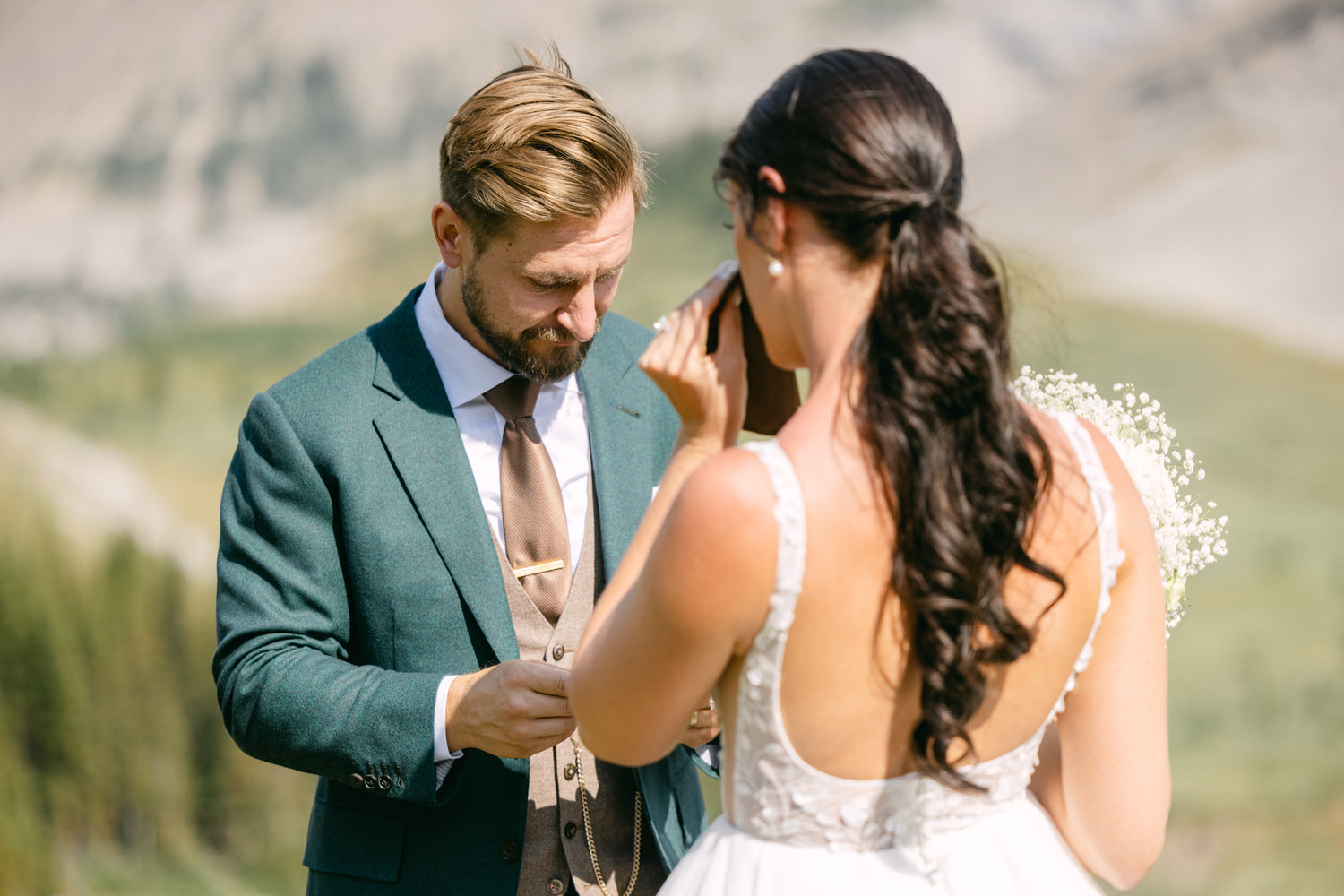 A couple exchanging heartfelt vows against a stunning natural backdrop, capturing a moment of deep emotion and connection.