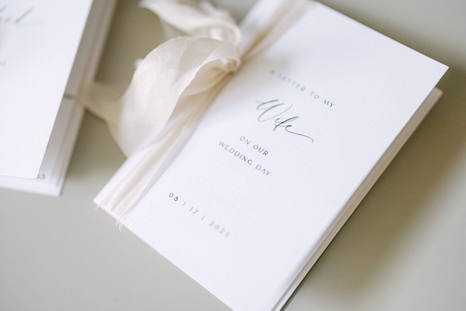 A beautiful letter addressed to a wife on her wedding day, styled with elegant typography and a soft ribbon.